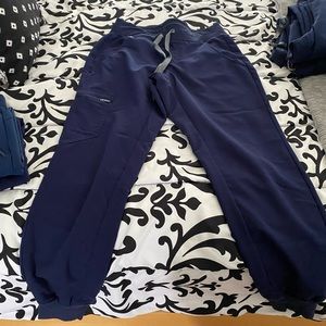 I have 2 of these scrub joggers. The price below is for each pair :)